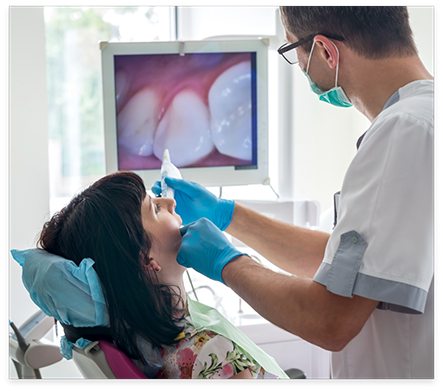 Dentist taking intraoral photos of a patients teeth