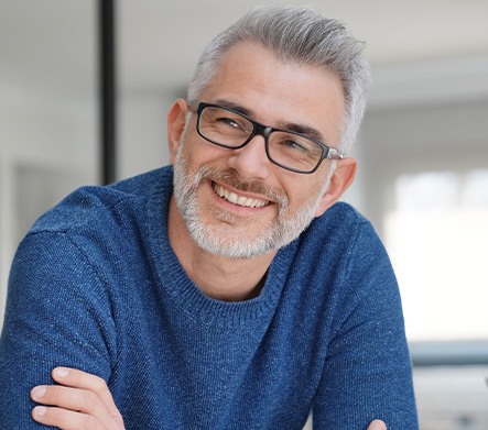 closeup of man smiling after getting dental implants